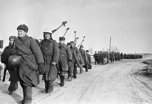 Soviet anti-tank gunners with PTRD-41 rifles marching near Vyazma, Russia, 4 Mar 1943