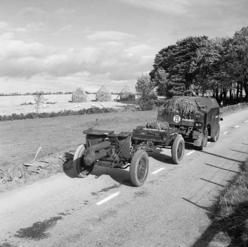 British Morris Quad vehicle towing an Ordnance QF 4.5 inch Howitzer of 51st Highland Division on the Huntly-Turniff road in Banffshire, Scotland, United Kingdom, 10 Oct 1940