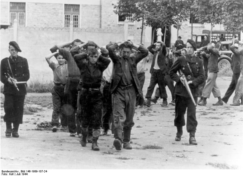 French militia escorting captured resistance fighters, France, Jul 1944