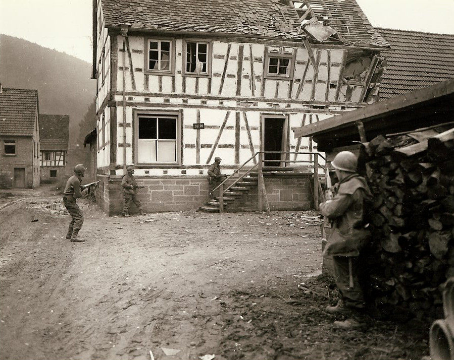 US 7th Army troops checking a house for snipers, western Germany, 16 Dec 1944