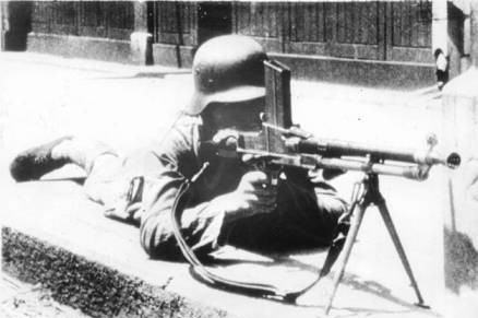 Chinese soldier with a ZB vz. 26 light machine gun in an urban street, date unknown